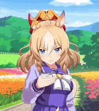 a girl with a crown on her head holds a cell phone in her hand