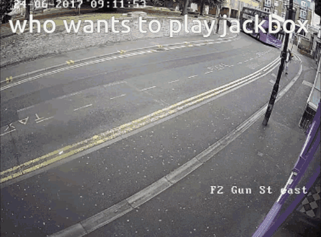a photo of a street with the words who wants to play jackbox