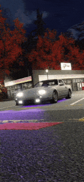 a silver car is parked in front of a 7 eleven store