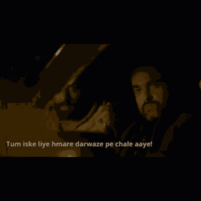 a man in a car with the words tum iske liye hmare darwaze pe chale aaye
