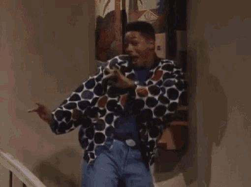 a man is dancing on the stairs in front of a painting .