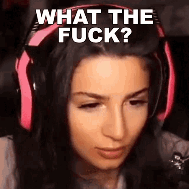 a woman wearing pink headphones with the words what the fuck on her face