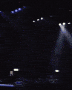mr. boogie jay kay performs on stage with a microphone