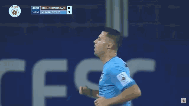 a soccer player in a blue jersey kicks the ball during a game