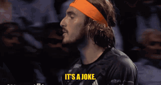 a man in an orange headband says it 's a joke