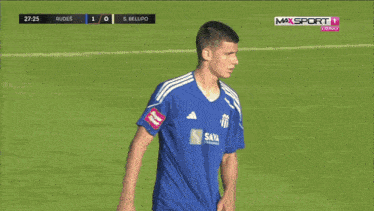 a group of soccer players on a field with one wearing number 23