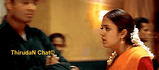a man and a woman are standing next to each other with a watermark that says thiruda n chat