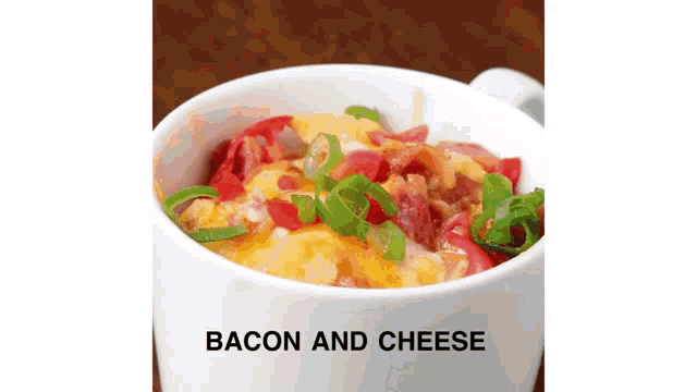 a bowl of bacon and cheese with green onions on top