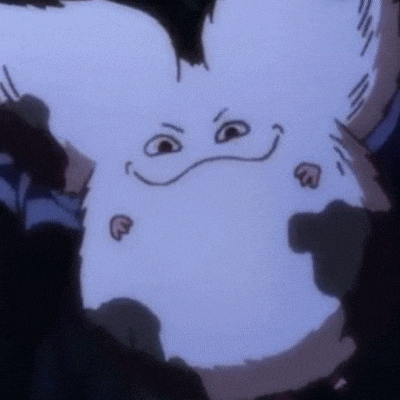 a close up of a cartoon character with a face drawn on it 's chest .