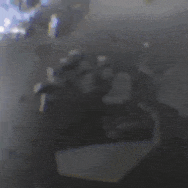 a blurred image of a person 's face with a purple and yellow stripe in the middle .