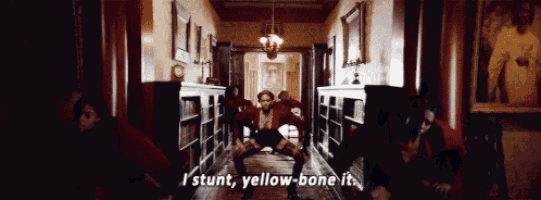 a group of people are doing a stunt in a hallway and they are saying i stunt yellow-bone it .