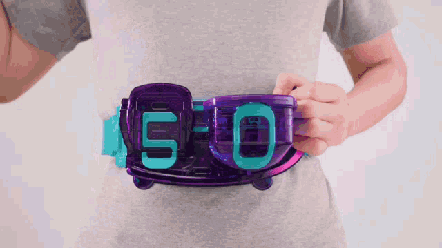 a person is wearing a purple and blue belt with the number 5 on it