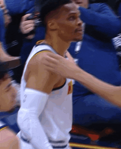 a basketball player with the letter p on his shirt