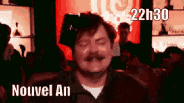 a man with a mustache is wearing a darth vader helmet and says nouvel an .
