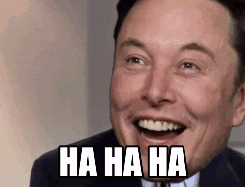 a man in a suit and tie is laughing with the words " ha ha ha " written on his face