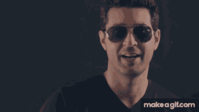 a man wearing sunglasses and a black shirt on make a gif