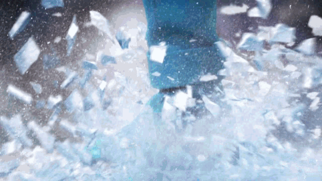 a person 's feet are covered in ice and snow