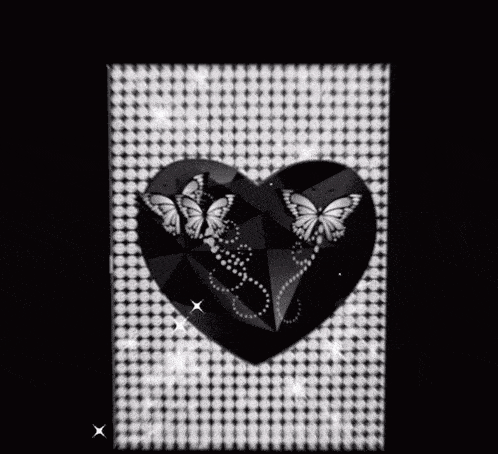 a black and white photo of hearts with butterflies