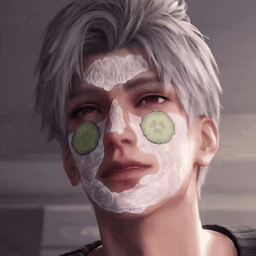 a man with cucumber slices on his face has a white mask on his face
