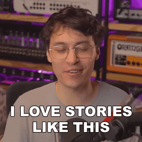 a man with glasses says " i love stories like this " in front of an orange amplifier