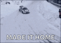 a car is driving through the snow with the words made it home below it