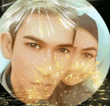 a man and a woman 's faces are in a circle with sparks coming out of them