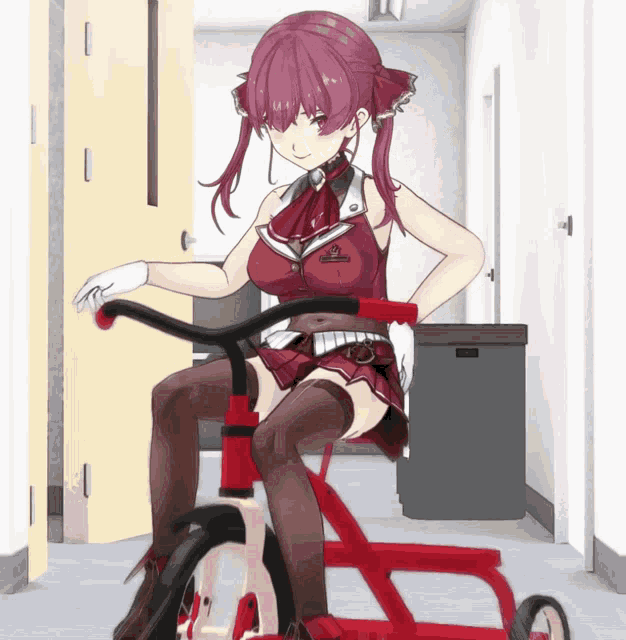 a girl with red hair is riding a tricycle in a hallway