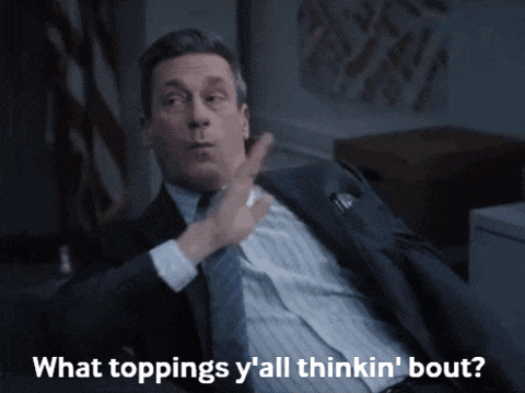 a man in a suit and tie says what toppings y all thinkin bout