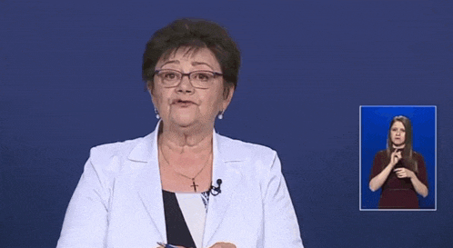 a woman wearing glasses and a white jacket holds a pen in front of a blue background