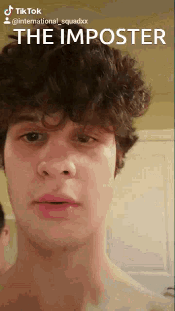 a young man with curly hair has a tik tok account