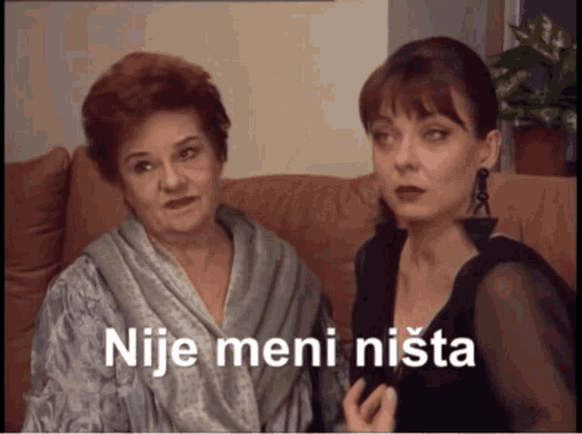 two women sitting on a couch with the words nije meni nista on the bottom right