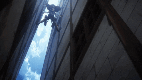 a person in a cape is hanging from a building