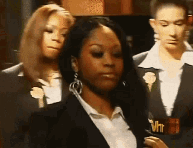a woman is holding a microphone that says vhr on it