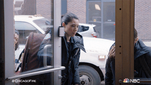 a woman is standing in a doorway with #chicagofire written on the bottom left