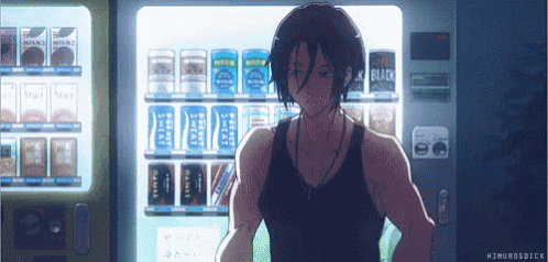 a man is standing in front of a vending machine that says black