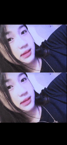 a girl in a black shirt is taking a selfie with a necklace around her neck