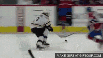 a hockey player with the number 2 on his jersey stands on the ice