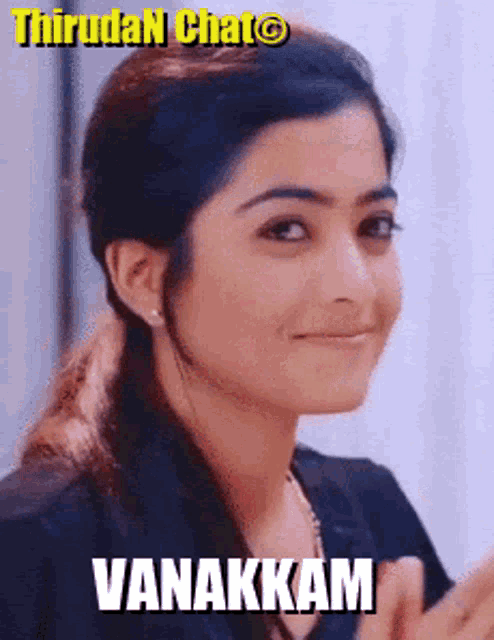 a close up of a woman 's face with the word vanakkam on it .