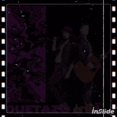 a woman singing into a microphone next to a man holding a guitar with the word duetazo on it