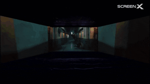 a dark room with a screen x logo on the top