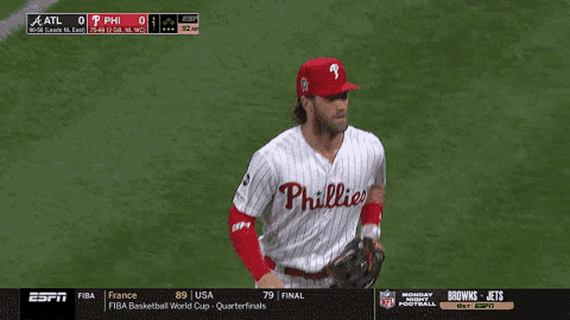 two phillies baseball players are on the field