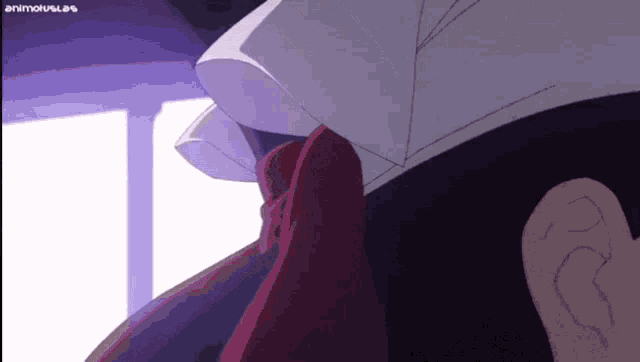 a close up of a person 's neck with a purple background and a purple ear