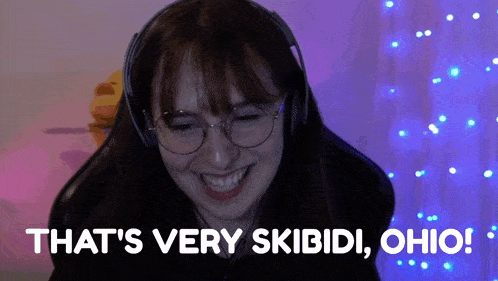 a woman wearing headphones says " that 's very skibidi ohio ! "