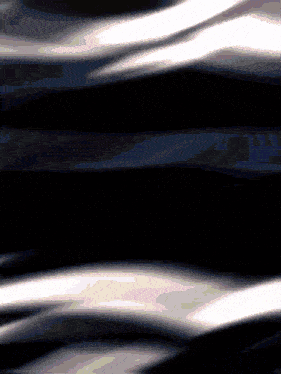 a black background with a few white waves on it