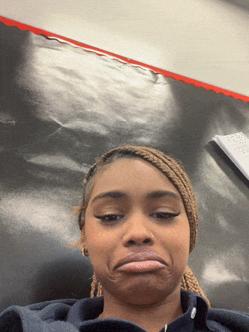 a girl making a funny face with her mouth open