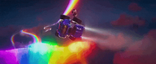 a cartoon character is flying through the air in a rainbow colored vehicle .