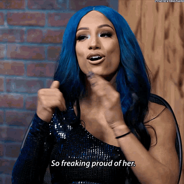 a woman with blue hair says she is so freaking proud of her