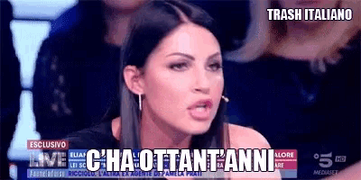 a woman is talking on a television screen with the words trash italiano on the bottom