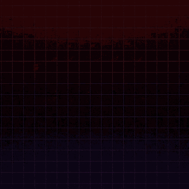 a brick wall with a red and blue pattern and the letter t on the bottom