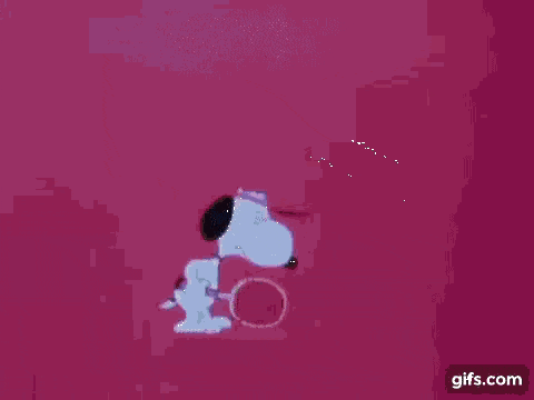 snoopy is laying on the ground with a pink background